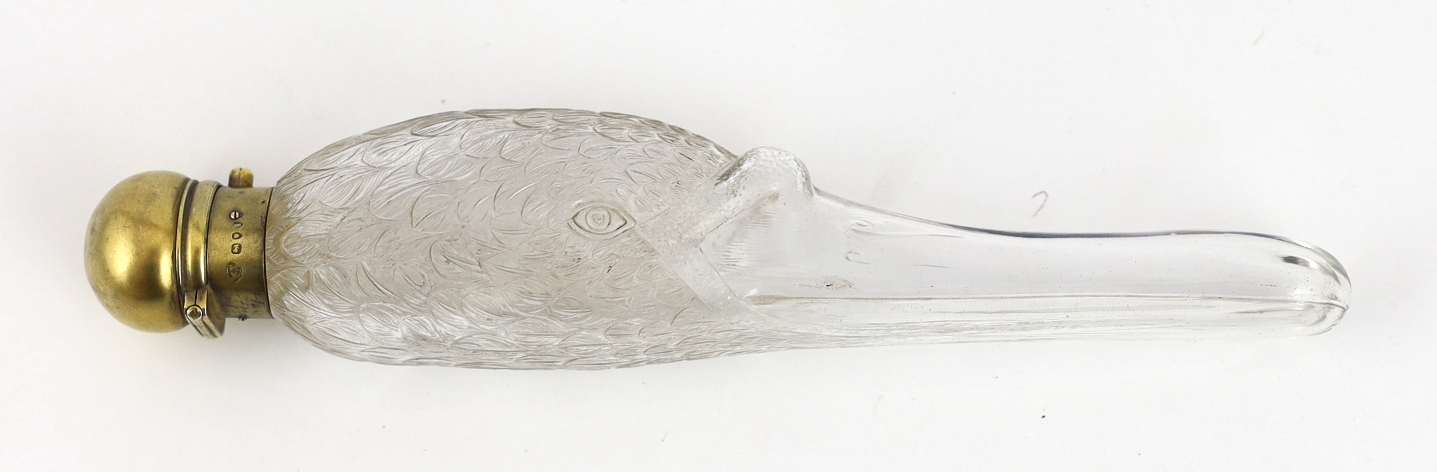 A Victorian silver gilt mounted moulded glass scent bottle, the glass body modelled as the head of a swan, by Walter Thornhill